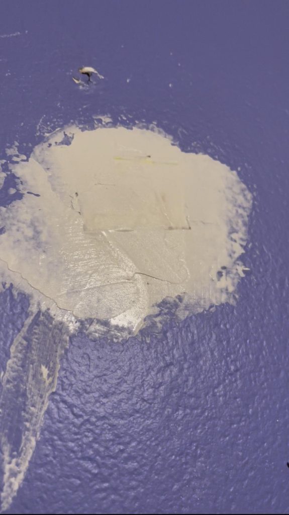 Image of a finished California patch with drywall mud