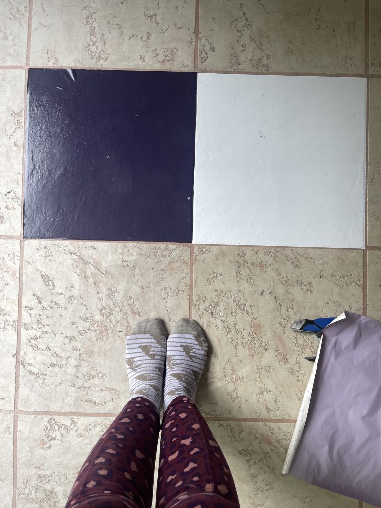 AFRO AND RENO in purple cheetah leggings standing over potential checkerboard floor colors deep purple and white